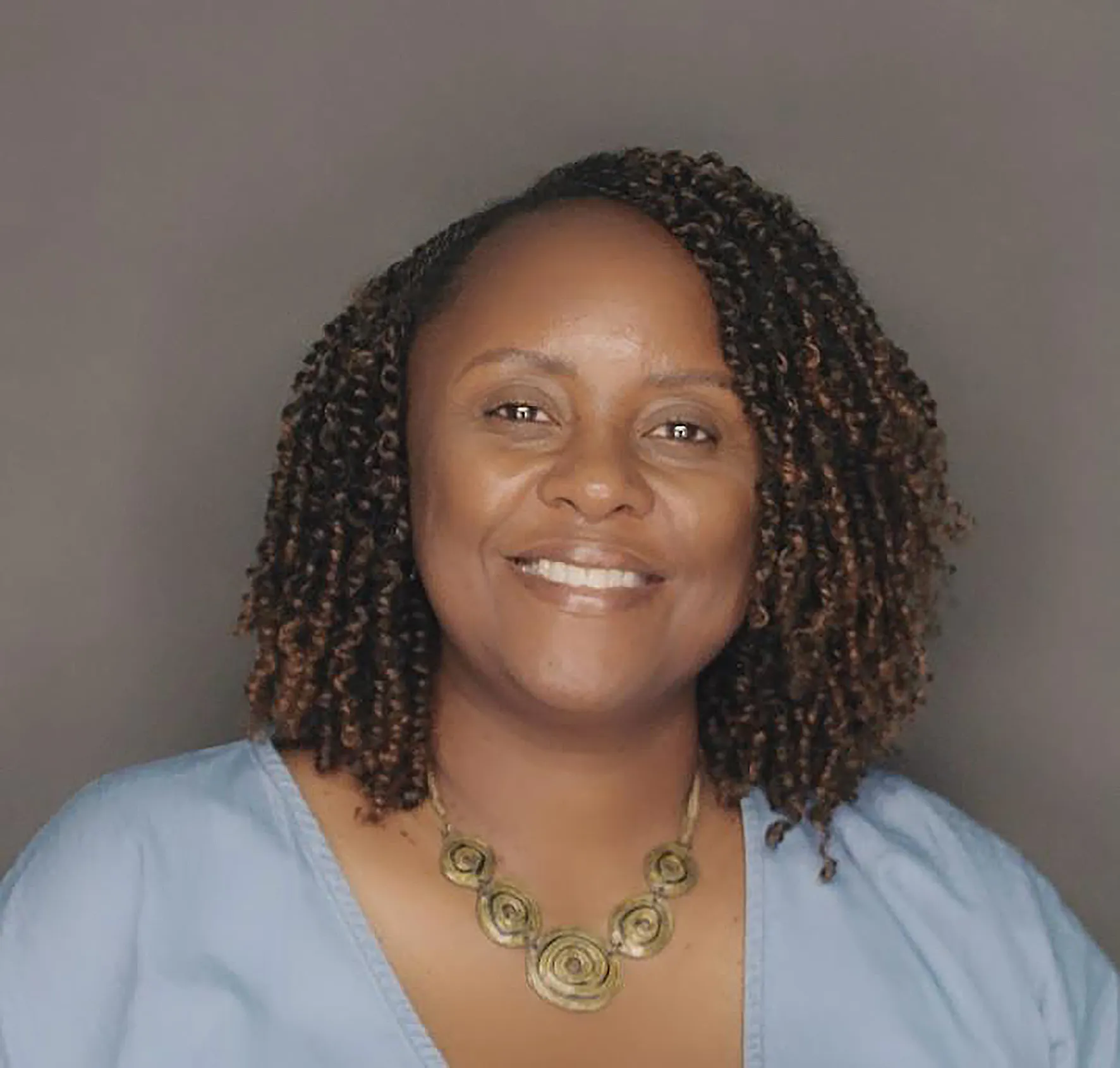 Portrait of Sarah Nyathira, smiling
